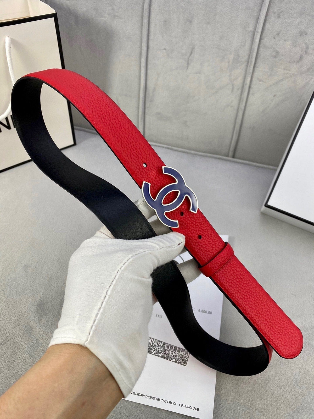CHANEL 30MM BELT IN CHERRY RED GRAINED CALFSKIN WITH NAVY BLUE METAL LOGO