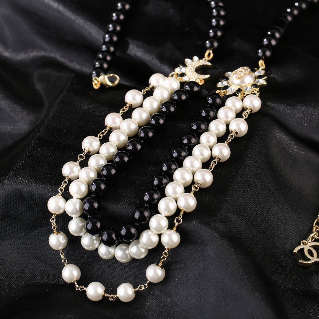 CHANEL 25S CHAIN BELT IN WHITE AND BLACK PEARL 614477