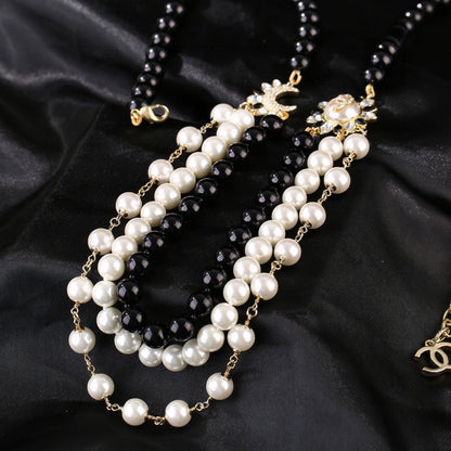 CHANEL 25S CHAIN BELT IN WHITE AND BLACK PEARL 614477
