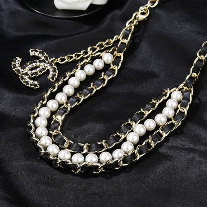 CHANEL 25S CHAIN BELT IN WHITE PEARL AND BLACK CALFSKIN 612711