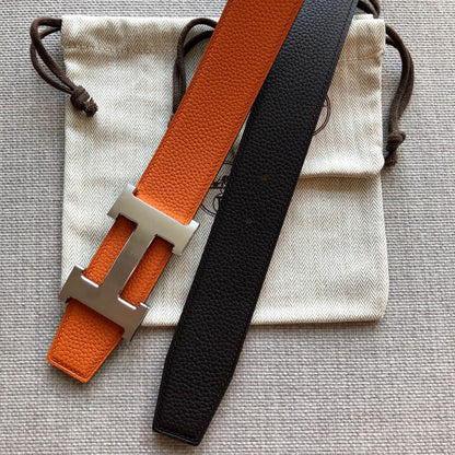 HERMES BELT BUCKLE & REVERSIBLE BLACK AND ORANGE LEATHER STRAP 38MM SILVER HARDWARE